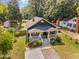 Aerial view of a charming home with a front porch and well-manicured yard at 109 St Marys St, Garner, NC 27529