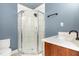 Modern bathroom featuring a glass shower, stylish vanity, and sleek fixtures at 109 St Marys St, Garner, NC 27529