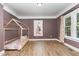 Bright bedroom features wood-look floors, a neutral color palette, and natural light at 109 St Marys St, Garner, NC 27529