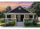 Charming home featuring a covered front porch and landscaped yard, perfect for enjoying the outdoors at 109 St Marys St, Garner, NC 27529