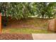 Backyard view with fence and treeline at 10941 Pendragon Pl, Raleigh, NC 27614