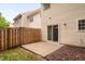 Backyard patio with sliding glass door and fenced-in yard at 10941 Pendragon Pl, Raleigh, NC 27614