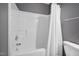 Full tub and shower combination featuring a white shower curtain at 10941 Pendragon Pl, Raleigh, NC 27614