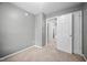 Neutral bedroom featuring a large closet and doorway into the hallway at 10941 Pendragon Pl, Raleigh, NC 27614