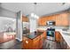 Modern kitchen featuring stainless steel appliances, spacious counters, and a breakfast bar at 10941 Pendragon Pl, Raleigh, NC 27614