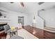 Spacious living room featuring hardwood floors and easy access to other living spaces at 10941 Pendragon Pl, Raleigh, NC 27614