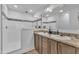 Bright bathroom featuring a double vanity with tan countertops and a walk-in shower at 1118 Oakridge Duncan Rd, Fuquay Varina, NC 27526