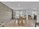 Dining room with wooden wall, round table, and chairs. Good natural light at 1118 Oakridge Duncan Rd, Fuquay Varina, NC 27526