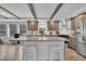 Spacious kitchen with an island, breakfast bar, modern appliances, and natural light at 1118 Oakridge Duncan Rd, Fuquay Varina, NC 27526