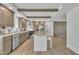 Open kitchen with center island, beams, recessed lights and stainless steel appliances at 1118 Oakridge Duncan Rd, Fuquay Varina, NC 27526