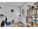 Functional laundry area with washer, dryer, storage shelves, and convenient access to the exterior at 1118 Oakridge Duncan Rd, Fuquay Varina, NC 27526