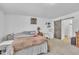 Comfortable main bedroom features a cozy bed, sliding barn door, and carpeted floors at 1118 Oakridge Duncan Rd, Fuquay Varina, NC 27526