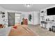 Bright main bedroom with carpeted floors, sliding barn door leading to en-suite bathroom, and ample space at 1118 Oakridge Duncan Rd, Fuquay Varina, NC 27526