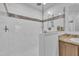 Bright walk-in shower featuring white tile and decorative accent tiles at 1118 Oakridge Duncan Rd, Fuquay Varina, NC 27526