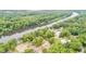 Aerial shot of a riverfront community surrounded by dense green trees at 1164 Keith Hills Rd, Lillington, NC 27546