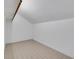 Bright attic with neutral walls and patterned flooring at 1164 Keith Hills Rd, Lillington, NC 27546