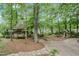 Expansive backyard featuring a gazebo, quaint sitting area, and scenic water views at 1164 Keith Hills Rd, Lillington, NC 27546