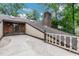 Spacious balcony with wooden railings and a view of the surrounding greenery at 1164 Keith Hills Rd, Lillington, NC 27546