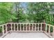 Scenic balcony overlooking a lush, green landscape and tranquil lake at 1164 Keith Hills Rd, Lillington, NC 27546