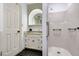 Bathroom with a walk-in shower, vanity, and black tile flooring at 1164 Keith Hills Rd, Lillington, NC 27546
