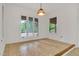 Sunny dining area with neutral tile and views of the outdoor greenery at 1164 Keith Hills Rd, Lillington, NC 27546