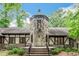 Unique stone tower entrance with brick steps and lush greenery at 1164 Keith Hills Rd, Lillington, NC 27546