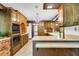 Functional kitchen with wood cabinetry, breakfast bar, and brick oven at 1164 Keith Hills Rd, Lillington, NC 27546