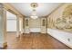 An open living room features hardwood floors, decorative columns, and built in china cabinets at 1164 Keith Hills Rd, Lillington, NC 27546