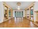 A bright living room is showcased with columns, hardwood floors and french doors at 1164 Keith Hills Rd, Lillington, NC 27546