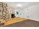 Inviting living room with a stone fireplace and hardwood flooring at 1164 Keith Hills Rd, Lillington, NC 27546