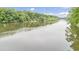 Scenic view of a wide, calm river surrounded by lush green trees at 1164 Keith Hills Rd, Lillington, NC 27546