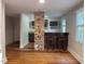 Bar area with stone column, wine rack, and bar seating at 119 W Vernon Ave, Wake Forest, NC 27587