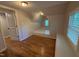 Attic bedroom with hardwood floors, natural light, and a storage space at 119 W Vernon Ave, Wake Forest, NC 27587