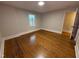 Bedroom with hardwood floors, natural light, and an attached closet at 119 W Vernon Ave, Wake Forest, NC 27587