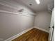 Walk-in closet with ample storage space and hardwood floors at 119 W Vernon Ave, Wake Forest, NC 27587
