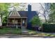 Charming two-story home with a covered porch and a well-manicured lawn at 119 W Vernon Ave, Wake Forest, NC 27587