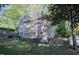 Exterior view showcasing the backyard, deck, and well-maintained landscaping at 119 W Vernon Ave, Wake Forest, NC 27587