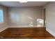 Bright and airy living room with hardwood floors and natural light at 119 W Vernon Ave, Wake Forest, NC 27587