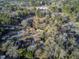 Scenic aerial view showcasing the neighborhood with mature trees and surrounding landscape at 126 Person St, Louisburg, NC 27549