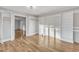 Large closet with custom built-in shelves and hardwood floors with natural light throughout at 126 Person St, Louisburg, NC 27549