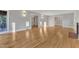 Spacious living room with hardwood floors, fireplace, lots of natural light, and doorways to other rooms at 126 Person St, Louisburg, NC 27549