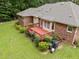 A backyard featuring a wood deck and lush landscaping at 143 Cedarwood Dr, Henderson, NC 27536