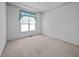 Bedroom with a window featuring a turquoise valance, carpet flooring and neutral walls at 143 Cedarwood Dr, Henderson, NC 27536
