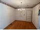Traditional dining room with hardwood floors, chandelier, and room for built-ins at 143 Cedarwood Dr, Henderson, NC 27536
