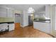 Spacious kitchen with white cabinets, built-in appliances, and open layout to dining area, perfect for entertaining at 143 Cedarwood Dr, Henderson, NC 27536