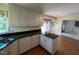 Kitchen with modern appliances and dark countertops at 143 Cedarwood Dr, Henderson, NC 27536