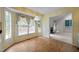 Inviting breakfast nook with natural light, laminate floors, and decorative wallpaper accents at 143 Cedarwood Dr, Henderson, NC 27536