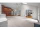 Open concept living room showcasing vaulted ceilings, fireplace, and seamless connection to the kitchen at 143 Cedarwood Dr, Henderson, NC 27536