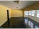 Bright living room with large windows and dark green floors at 143 Cedarwood Dr, Henderson, NC 27536