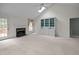 Vaulted Living room with fireplace, custom built-ins and access to deck at 143 Cedarwood Dr, Henderson, NC 27536